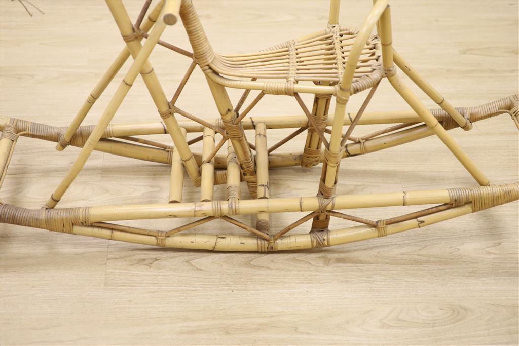 A bamboo and wicker rocking horse